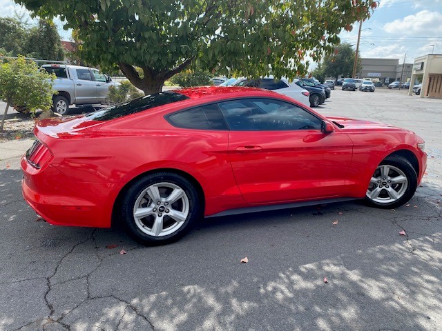 red vehicle with perfectly repaired rocker panel after collision work